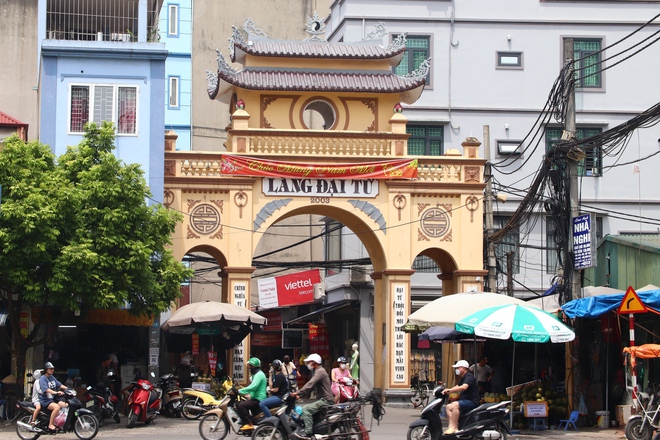 Chùm ảnh: Những cổng làng cổ kính trong lòng phố phường tấp nập của Hà Nội - Ảnh 16.