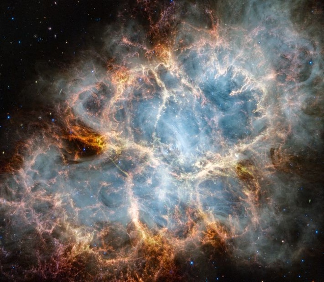 Hé lộ hình ảnh chưa từng thấy của Tinh vân Con Cua qua Kính thiên văn James Webb - Ảnh 1.