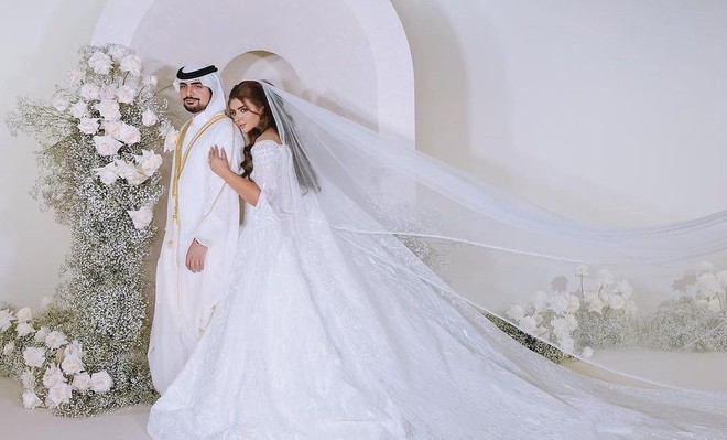 Đám cưới xa hoa của tỷ phú công nghệ và Công chúa Dubai: Váy đính kim cương, bánh cưới 7 tầng! - Ảnh 2.