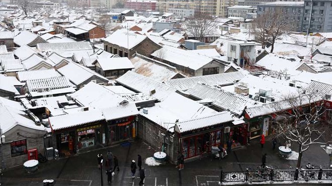 Trung Quốc: Tuyết đầu mùa bao phủ tạo nên cảnh tượng đẹp đến nao lòng tại Tử Cấm Thành - Ảnh 1.