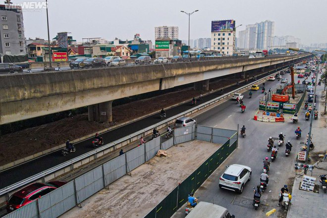 Dân phá trụ bê tông, mở lối đi vào làn mở rộng trên tuyến đường dày đặc lô cốt - Ảnh 4.