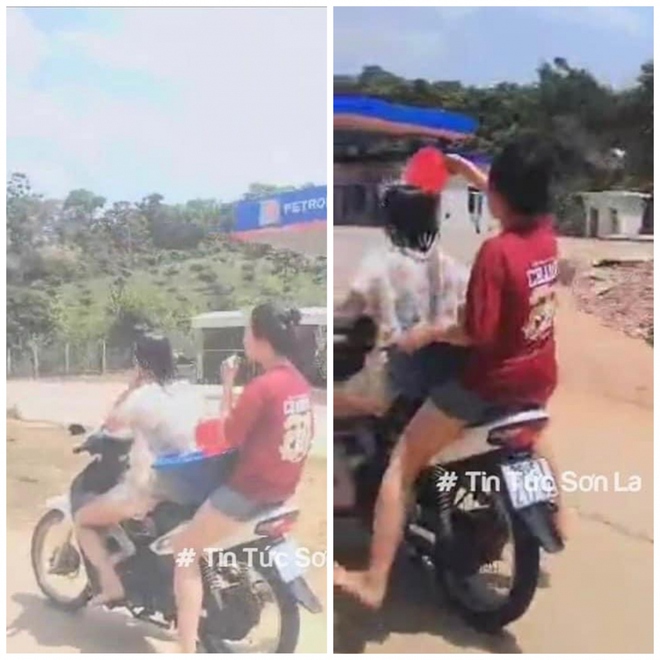 Hai nữ sinh ở Sơn La vừa lái xe vừa “tắm” cho nhau bị phạt - Ảnh 2.