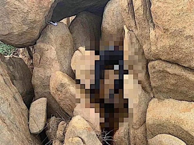 Phát hiện thi thể nam giới kẹt trong khe đá ở Bình Thuận - Ảnh 1.