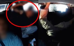 Mưa lớn khiến giao thông tê liệt, du khách la hét, ném điện thoại rồi có hành động phản cảm trên taxi