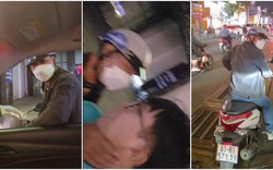 Tài xế taxi bị người đàn ông đi xe máy bóp cổ, xô ngã giữa đường