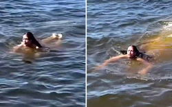 "Thủy quái" lặng lẽ bơi ngay sát người phụ nữ đang tắm sông, chỉ vài chục giây khiến mạng xã hội xôn xao