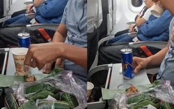 Mang cả túi nem chua, khui bia nhậu ngay trên máy bay, 2 người đàn ông gây tranh cãi dữ dội