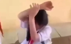 Nữ sinh lớp 8 bị bạn cùng lớp đánh, ép cởi áo để quay clip