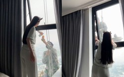 Mát lòng cảnh cô gái mời nước anh thợ treo mình giữa trời nóng lau kính cao ốc