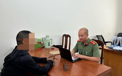 Công an làm việc với người đàn ông vì tương tác với trang Thoibao.de