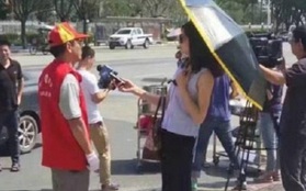 Nữ phóng viên Trung Quốc bị đình chỉ vì đeo kính râm, cầm ô che nắng trong lúc tác nghiệp