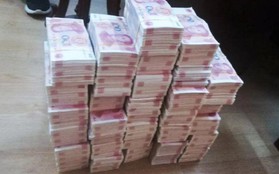 Trung Quốc: Hai người đàn ông in tiền giả bán để trả tiền viện phí cho con gái