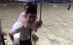 "Em gái mưa" phiên bản lũ lụt: Câu chuyện đằng sau bức ảnh chú rể cõng cô dâu đứng giữa biển nước đang nổi rần rần MXH