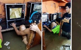 Game thủ nhí phớt lờ nguy cơ bị điện giật, chìm đắm trong game khi quán net ngập nước lũ