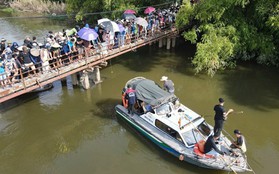 Ảnh: Đội cứu hộ và hàng trăm người dân cùng tìm kiếm cô gái mất tích tại Hà Nội