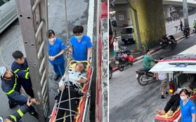 Cảnh sát dùng thang dây cứu thanh niên rơi từ mặt cầu Chương Dương xuống đất