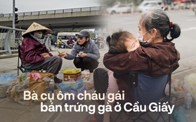 Nước mắt phía sau bức ảnh bà cụ bán trứng ôm bé gái ở ngã tư Cầu Giấy