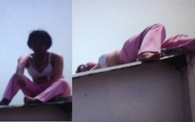 Một phụ nữ cởi áo, nằm trên nóc trụ sở công an để… ăn vạ