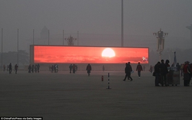Ô nhiễm không khí nghiêm trọng, Trung Quốc chiếu cảnh mặt trời mọc trên màn hình LED