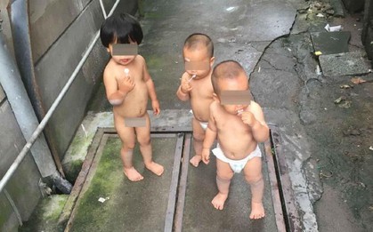 Cô bé 2 tuổi miệng ngậm kẹo mút, tay dắt theo cặp song sinh 1 tuổi bỏ nhà ra đi