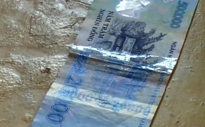 Cắt ghép tờ 20.000 đồng với tờ 500.000 đồng để chiếm đoạt tài sản