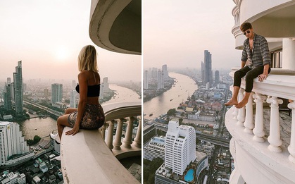 Travel blogger có 2,7 triệu followers đăng ảnh ngồi cheo leo trên lan can, tưởng gây ấn tượng nhưng kết quả nhận về cả rổ gạch đá