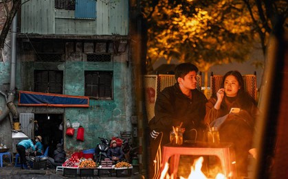 Chùm ảnh Hà Nội những ngày chìm trong giá rét: Phố lớn ngõ nhỏ nhuốm màu trầm tư, hàng quán đốt than củi sưởi ấm