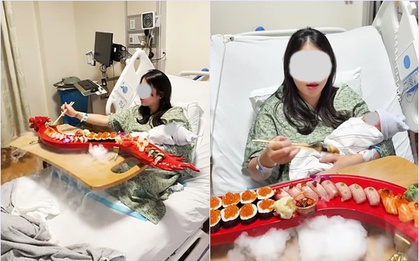Sản phụ gây tranh cãi dữ dội vì vừa sinh xong đã mukbang sushi ngay trên giường bệnh, ôm con ngồi ăn giữa làn khói mịt mù
