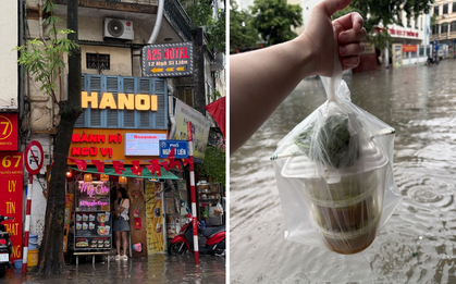 Loạt hàng quán ngập nước vẫn mở cửa, trở thành chỗ trú cho khách giữa thời tiết mưa lớn ở Hà Nội