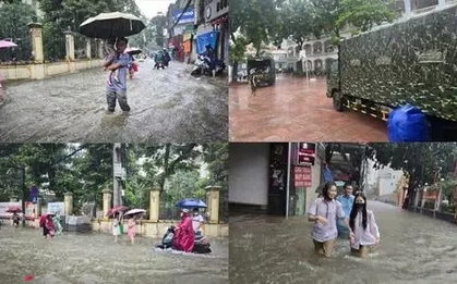 Thủ đô ngập lụt chưa từng có: Quân đội điều xe cứu trợ, phụ huynh bì bõm cõng con tan trường
