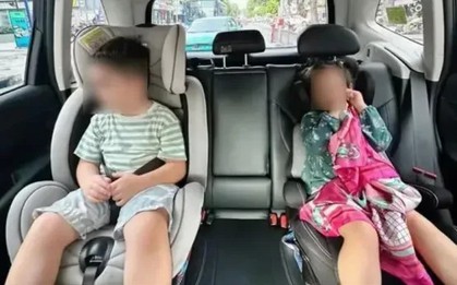 Người lớn ngồi ghế phụ ô tô có được ôm trẻ em ngồi cùng không? Cục CSGT giải đáp