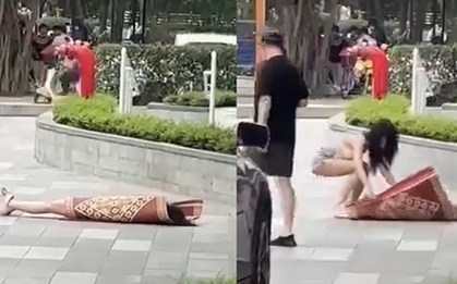 Clip hot girl có hành động khó hiểu, nằm đắp chiếu giữa sảnh chung cư đông người