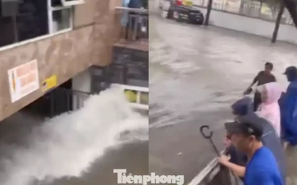 Nước mưa cuồn cuộn như thác tràn vào tầng hầm chung cư ở Nghệ An
