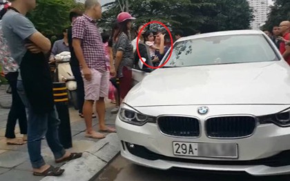 Bố dùng búa đập vỡ kính xe BMV để giải cứu con gái
