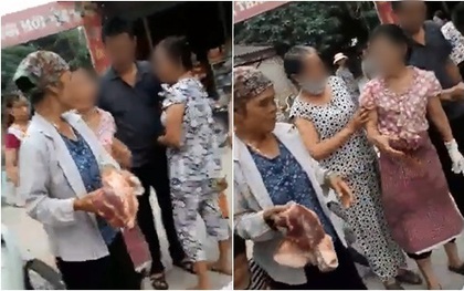 Xác minh tiểu thương cướp và đe dọa người phụ nữ không được bán thịt lợn ở Hà Nội