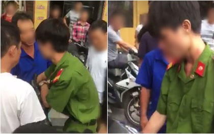 Công an xác minh thanh niên mặc quân phục, không đeo biển tên bị người dân vây đánh khi bắt xe vi phạm