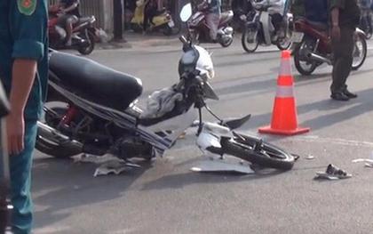 Xe máy rụng bánh sau va chạm, đôi nam nữ lọt dưới gầm xe tải