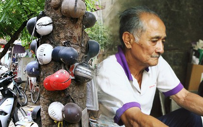 Chuyện về cụ ông Hà Nội phía sau cây cổ thụ treo hàng chục chiếc mũ bảo hiểm sứt mẻ trên đường Trần Hưng Đạo