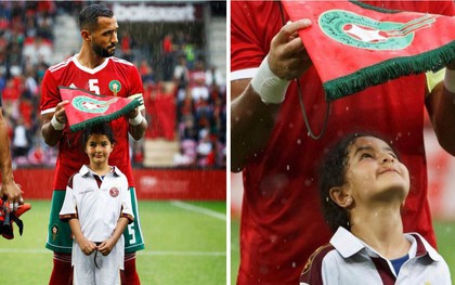 Loạn nhịp trước khoảnh khắc Medhi Benatia (Morocco) dùng cờ hiệu che mưa cho bé gái trên sân cỏ