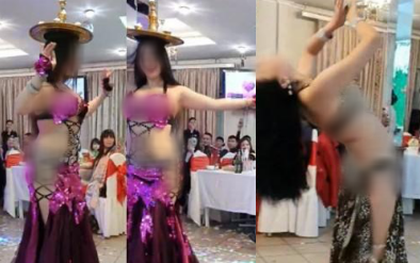 Hình ảnh hai cô gái ăn mặc hở hang vô tư uốn éo, múa bụng trước mặt trẻ con trong đám cưới gây xôn xao