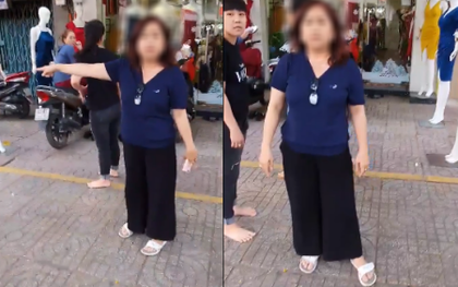 Chạy xe mệt tấp vào vỉa hè nghỉ một chút, tài xế xe ôm công nghệ bị chủ shop thời trang đuổi xơi xơi rồi miệt thị: "Ngồi phơi cái bụng mỡ ra như con heo"