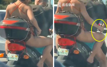 Người phụ nữ  gây sốc khi thản nhiên vừa ngồi xe máy vừa cạo lông chân ngay trên đường cao tốc