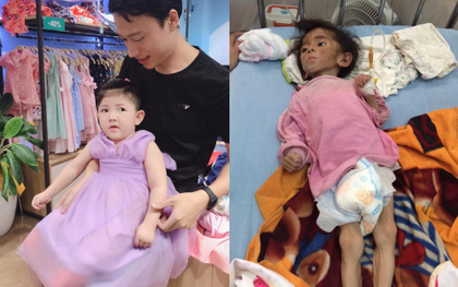 Hình ảnh em bé Lào Cai bụ bẫm đáng yêu trong bộ váy tím khi được bố nuôi bế khiến nhiều người chú ý
