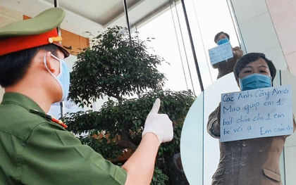 Phía sau hình ảnh người phụ nữ trong khu cách ly ở Đà Nẵng với tấm biển nhờ các anh công an "mua giúp em 1 bát cháo cho em bé"