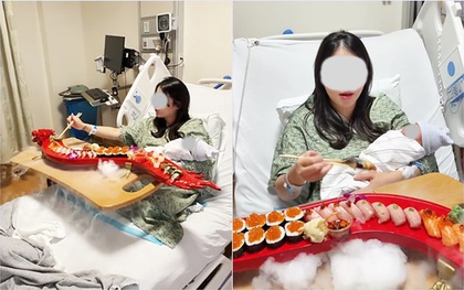 Sản phụ gây tranh cãi dữ dội vì vừa sinh xong đã mukbang sushi ngay trên giường bệnh, ôm con ngồi ăn giữa làn khói mịt mù