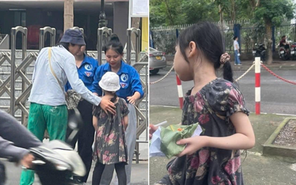 Em gái lớp 2 ngồi cổng trường thi đợi anh trai gây sốt mạng
