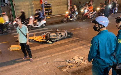 TPHCM: Người đàn ông ngã xuống đường, bị ô tô cán qua?