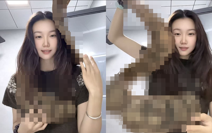 Cô gái thản nhiên quấn "con rắn" khổng lồ quanh người lên máy bay, hành khách xôn xao khi biết đó là gì