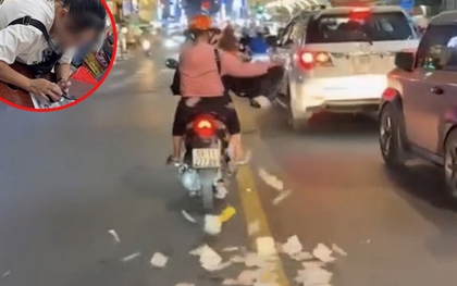 Người phụ nữ rải giấy tiền tứ tung ra giữa đường ở TP.HCM: Bất ngờ nguồn cơn và cái kết