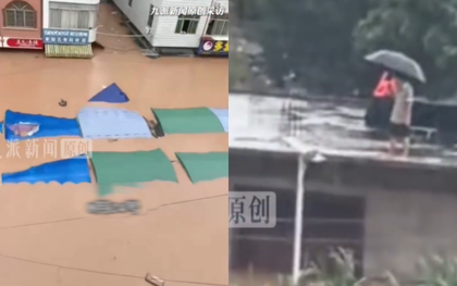 Bão Narra càn quét gây lũ lớn ngập đến tầng 2, người dân suy sụp đứng trên mái nhà cầu cứu
